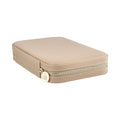 Pale pink jewelry case with gold logo zipper, rounded corners, and compact design
