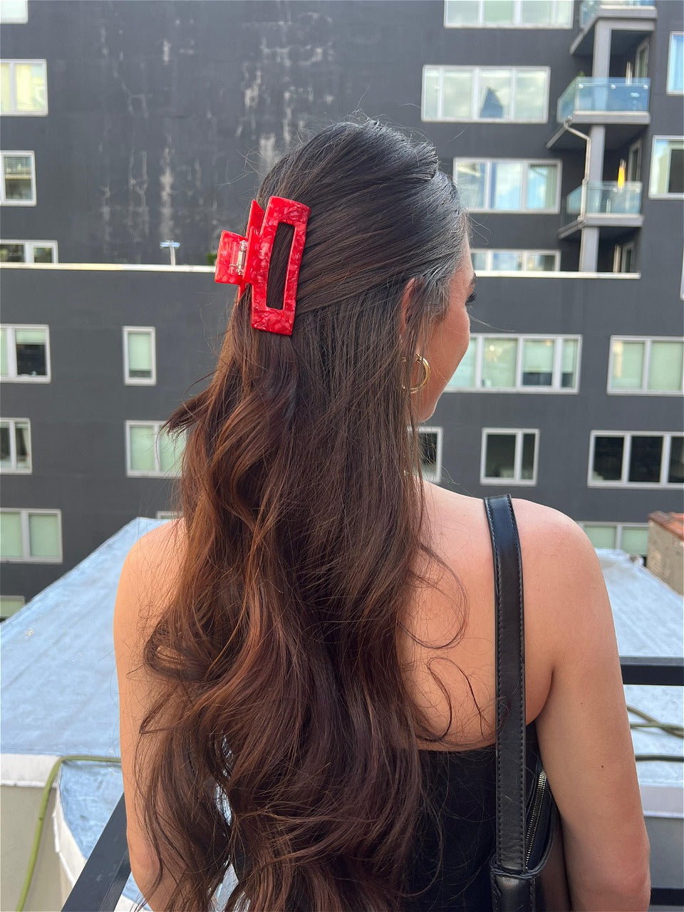 A beautiful girl wearing wearing clip and earings of Reclaimed with Love