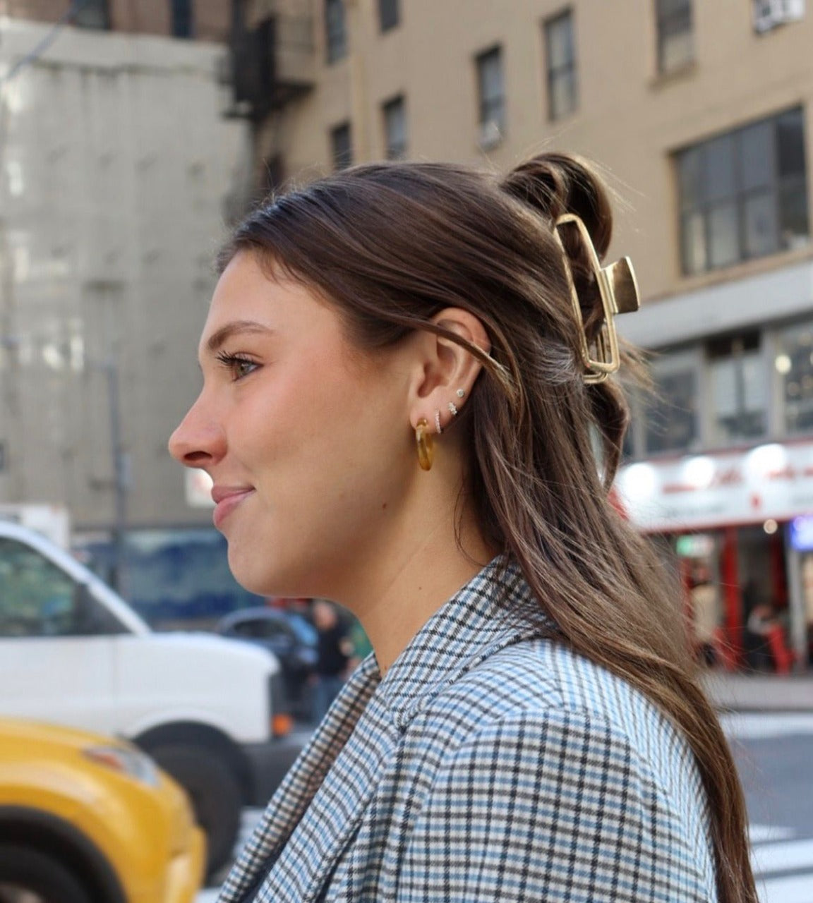 A beautiful lady wearing earings of Reclaimed with Love